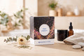 TREMP Longevity von Burgerstein microCare – Verpackung auf Holztisch mit Blüte und Eukalyptus