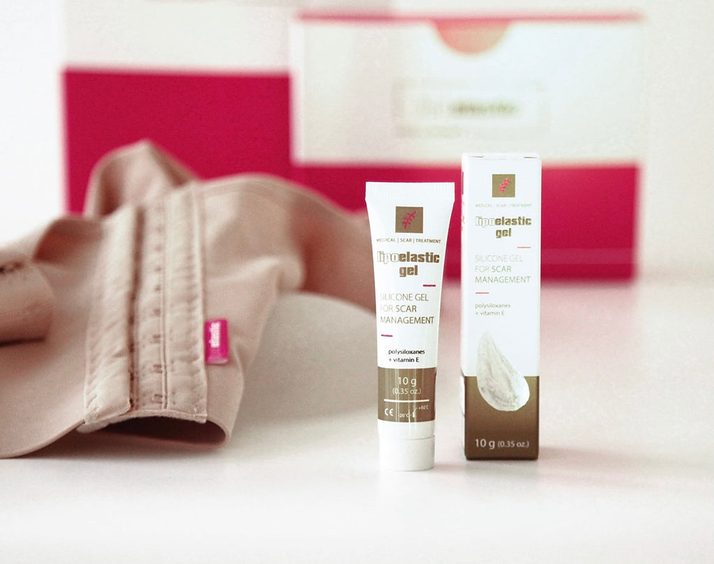 Lipoelastic Gel auf rosa Hintergrund – Flatlay